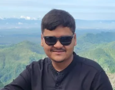 Madhav Soni - Creative Lead at Urban Café with curly dark hair and statement earrings