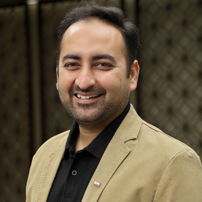 Mehul Kotecha - Marketing Director at NexaTech with short blonde hair and business casual attire